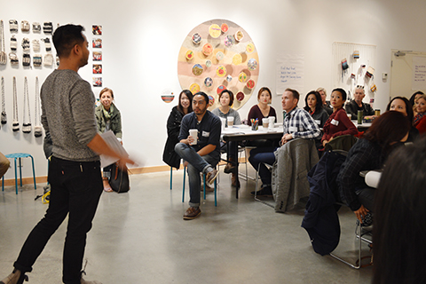 A person leads a facilitation for a group of coworkers as part of ArtStarts' Creativity Unpacked services