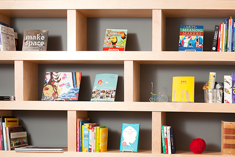 The ArtStarts library featuring books on a shelving unit
